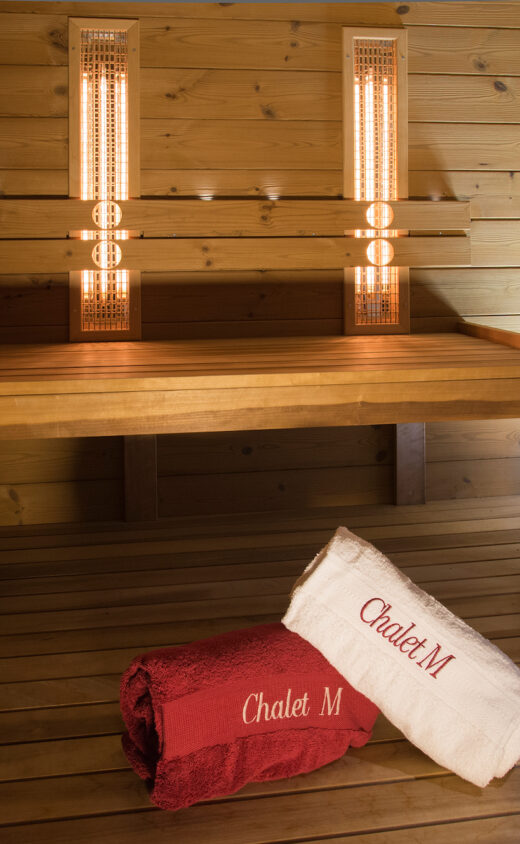 Sauna in Chalet Maldeghem with rolled up towels