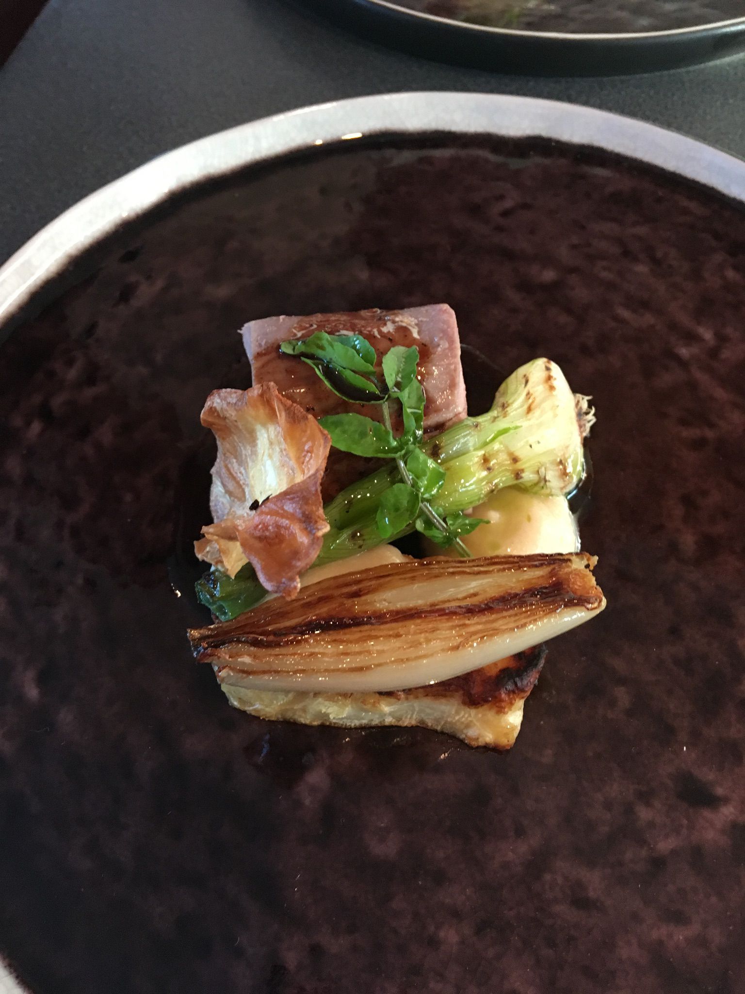Fine dining dish on a plater, created by chef at Chalet Maldeghem - catered chalet in Switzerland