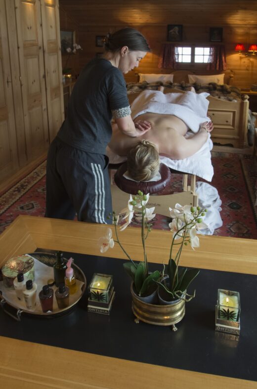 Massage therapist providing a massage in Chalet Maldeghem in Klosters, Switzerland